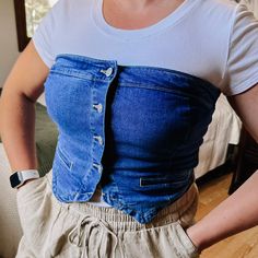 This piece is so fun! A strapless denim top with working buttons, cropped length, smocked back for ultimate comfort, and a double pointed hem in the front. Wear this to the next country concert, girls day, or for casual daily wear! I have it paired with our Count On Me Top in white Fabric: 72% cotton, 24% polyester, 3% rayon, 1% spandex I am wearing the size large - I would say this is very true to size. If you're between, you could size down since it has really nice stretch. If you are bustier, Wedding Guest Accessories, Faith Based Gifts, Wedding Journal, Maxi Jumpsuit, Girls Day, Country Concerts, Country Concert, Sweater Tank Top, Lounge Shorts