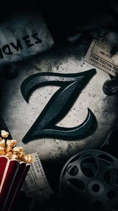 a movie poster with the letter z in front of it and popcorn on the table