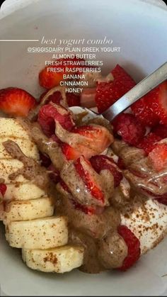 a bowl filled with bananas and strawberries