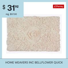 a white rug with the words home weavers inc belflower quick $ 31 99