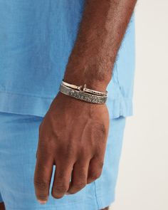 A Vibe signature, the St. John Hook Bracelet is fashioned in gently hammered sterling silver with a "J" hook clasp to honor the island of St. John. Featuring the St. John coordinates and seven good luck wraps, solo or stacked, it is sure to be a favorite statement piece. Found in many of our designs, Vibe’s seven good luck wraps represent love, laughter, happiness, good fortune, health, unity, and peace. In the Caribbean tradition, wear your hook facing in to keep love close to your heart, and f Hook Bracelet, Gold Wrap, Hammered Sterling Silver, Gold Piece, Hook Clasp, A J, Sterling Silver Bands, New Love, Unique Charms