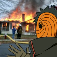 a house on fire with people standing in front of it and the flames coming out