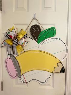 a door decorated with paper cutouts and ribbons