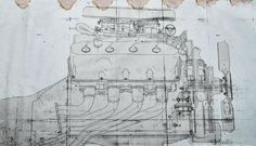 a drawing of a car engine on top of a piece of paper with words written below it