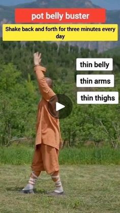 a man in an orange outfit standing on top of a field holding a frisbee