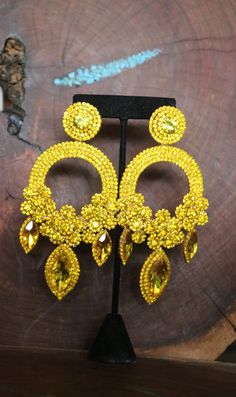 "These fun and stylish oversized crystal rhinestone earrings are a great statement piece! Pageant, photo shoots or fitness competitions! Size of earrings: 2.5\" Wide and 5.25\" Long. Color: Citrine Yellow rhinestones Looking for a matching bracelet? Check out our listings or send us a message! https://www.etsy.com/listing/701653437/yellow-bracelet-yellow-rhinestone?ref=shop_home_active_58 https://www.etsy.com/listing/600464738/yellow-bracelet-yellow-and-gold-bracelet?ref=shop_home_active_47 Look Yellow Dangle Crystal Earrings For Party, Yellow Dangle Chandelier Earrings For Party, Yellow Crystal Earrings For Party, Yellow Dangle Crystal Party Earrings, Yellow Rhinestone Jewelry For Party, Yellow Rhinestone Party Jewelry, Pageant Earrings, Clear Crystal Earrings, Bridal Clip