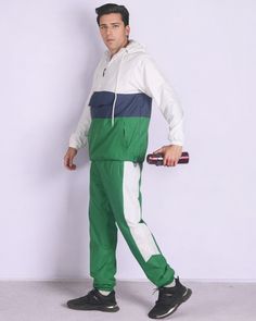 This quarter zip windbreaker Tracksuit outfit is composed of a smooth nylon exterior which is durable. The windbreaker tracksuit is fully meshed lined. Quarter zip windbreaker tracksuits are a great choice for working out at the GYM, on the sports field and everyday casual activities. The relaxed fitting of this windbreaker tracksuit enables maximum movement, comfort for everyday wear and makes it a great choice for the wardrobe. About this item1. Quarter zip windbreaker Track jacket with hoodie Hooded Tracksuit For Outdoor Activities, Hooded Tracksuit For Outdoor Sportswear, Casual Nylon Tracksuit For Streetwear, Green Casual Tracksuit For The Gym, Athleisure Tracksuit With Pockets For Outdoor, Casual Green Tracksuit For The Gym, Windproof Sportswear Windbreaker For Gym, Athleisure Outdoor Tracksuit With Pockets, Casual Hooded Tracksuit For Outdoor Activities