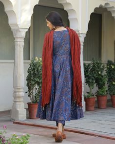 This is a stunning 3 piece set. It comes with a block-printed kurta with a round neck. The kurta is calf length and is paired with a set of printed semi-elasticated ankle length palazzo pants and a dupatta to match. Color- Blue & Red Work-Print Work with gota detailing and piping. Suit Fabric-Cotton Dupatta Fabric-Mulmul with beads detailing Sleeves-3/4th sleeves Neck-Round Neck Length-Ankle Length Care-Hand Wash or Dry Clean Fitted Indigo Kurta For Navratri, Ankle-length Block Print Kurta For Navratri, Festive Indigo Anarkali Set, Festive Indigo Anarkali Kurta, Ankle-length Block Print Kurta For Diwali, Festive Ankle-length Block Print Kurta, Indigo Anarkali Kurta, Straight Style, Blue Anarkali Set With Kalamkari Print, Fitted Blue Kurta With Kalamkari Print