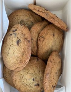 a white box filled with chocolate chip cookies