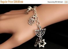 HALLOWEEN SALE Jewish Bracelet. Jewish Charm Bracelet. Silver Bracelet. Judaic Bracelet. Jewish Jewelry. Judaic Jewelry. Handmade Jewelry. by GatheringCharms from Gathering Charms by Gilliauna. Find it now at https://ift.tt/2evVC91! Silver Symbolic Charm Bangle Bracelet, Silver Symbolic Bracelets With Dangling Charms, Handmade Symbolic Silver Charm Bracelet, Symbolic Silver Bracelets With Dangling Charms, Symbolic Silver Bangle Charm Bracelet, Symbolic Silver Bracelet With Dangling Charms, Symbolic Handmade Silver Charm Bracelet, Silver Symbolic Charm Bracelet Hypoallergenic, Symbolic Silver Hypoallergenic Charm Bracelet