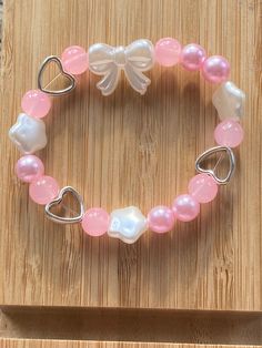 ੈ  An adorable bracelet with the colours pink and white, it includes heart and star charms with a bow in the middle <3 Handmade by me :) Snowflake Making, Bead Bracelet Ideas, Bracelets Bead, Girly Bracelets, Paper Snowflake, Bracelet Craft Diy, Kandi Bracelets, Bow Bracelet, Diy Bracelet Designs