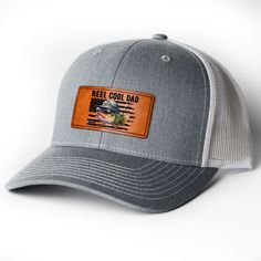 Introducing the "Catch of the Day" Leather Patch Hat! This stylish hat is an essential accessory for any fishing enthusiast. Crafted with a high-quality leather patch that boasts the emblematic fish hook, it's a symbol of both passion and prowess in the fishing community. The rugged, durable design ensures that it stands up to the outdoor elements, whether you're casting lines at dawn or reeling in the big one as the sun sets. MESSAGE: Reel cool dad. PRODUCT DETAILS: Material: Crafted from a high-quality blend of 60% Cotton and 40% Polyester, this hat features a breathable mesh backing. The absorbent cotton sweatband helps keep you cool and dry. Actual size: 23.68". 3 colors available in heather grey/white, heather grey/black and black. Reeling In The Big One, Reel Cool Dad, Leather Patch Hat, Catch Of The Day, Black And Black, Patch Hat, White Heather, The Big One, The Catch