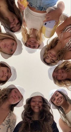 a group of young women standing in a circle