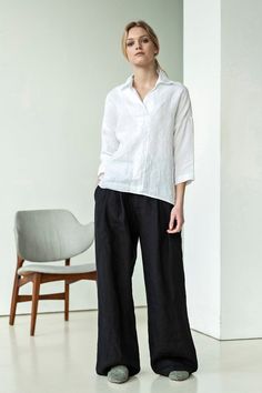 White linen shirt for women with 3/4 length sleeves. It is an oversized shirt and loose fit with a deep décolleté. It will be perfect work shirt or casual shirt - you name it. White linen top, white linen top, spring linen shirt, summer linen top. Linen outfit. White shirt with black pants. Boho looks. Boho outfit. #naturallinen #linenshirt #whiteshirt#whitelinenshirt #casualshirt#whiteblouse #ecofashion #whitelinentop #summerlinentop #springlinentop #summerlinenblouse #whitelinentop #boholooks Relaxed Linen Blouse For Work, Chic Linen 3/4 Sleeve Blouse, Chic Linen Blouse With 3/4 Sleeves, Versatile Linen Collared Blouse, Relaxed Linen V-neck Blouse, Casual Linen V-neck Blouse, Effortless Linen V-neck Blouse, Casual Linen Blouse With 3/4 Sleeves, Summer Linen Blouse With 3/4 Sleeves