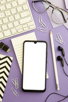 a cell phone sitting on top of a purple table