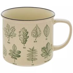 a coffee mug with different types of leaves on it