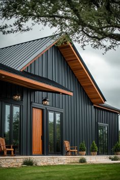 Contemporary barn-inspired home with dramatic roof, industrial fixtures, and rustic-modern fusion Industrial Fixtures, Contemporary Barn, Exposed Beams