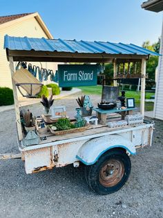 an old white truck is parked in front of a building with a sign that says farm stand on it