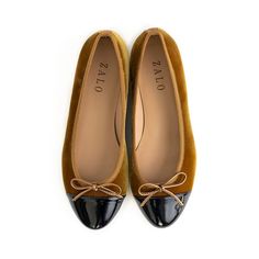 Our Beba ballet flat in golden Curry Italian Velvet features a delicate bow detail in leather, matching grosgrain trim, and a black patent toe cap. Also available in Charcoal. Napa Leather Lining for additional support and comfort .75 inch Leather Stack Heel Leather Sole Velvet treated to be water repellant Made in Spain Golden Curry, Fall Favorites, Cotton Velvet, Ballet Flat, Black Patent Leather, Bow Detail, Stacked Heel, Ballet Flats, Patent Leather