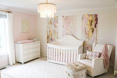 a baby's room is decorated in pink and gold