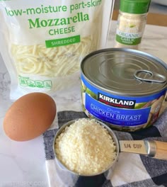 ingredients to make mozzarella cheese laid out on a counter top next to an egg