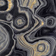 an abstract black and gold background with swirly lines in the center, on top of each other