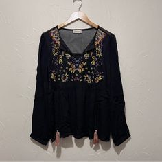 Size Medium. New W Tags. Black In Color W Multi Color Embroidered Detail On Chest, Optional Tie Detail, Mesh Exterior Material (100% Rayon). Retails For $69.95. Boho Chic Bohemian Peasant Embroidery Embellishment Organic Black Peasant Top With Floral Embroidery For Festivals, Black Long Sleeve Embroidered Top For Summer, Black Embroidered Long Sleeve Top For Summer, Black Summer Festival Peasant Top, Black Folk Style Peasant Top For Summer, Black Long Sleeve Peasant Top For Festival, Black Embroidered Peasant Top For Festivals, Fall Bohemian Black Embroidered Top, Casual Black Peasant Top With Floral Embroidery