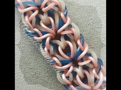 there are many pink and blue rings on the hairbrushes that have been curled together