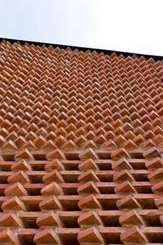 a red brick wall that has been made to look like an intricate pattern