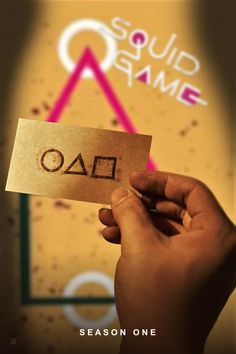 a person holding up a piece of paper with the word oud game written on it