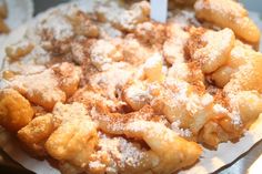 a close up of a plate of food with powdered sugar toppings on it