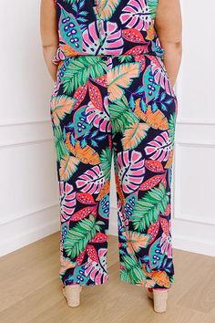 - Break away from the everyday and step into tropical style with these adorable high waist pants! Whether you are posing under the palms in a beachside paradise or simply adding a splash of the tropics to your casual summer style, these cuties have you covered. Embrace a laid-back island vibe with every step in these fabulous pants. - Unlined lightweight material with a pink, purple, green, and orange hued tropical botanical print - A high stretchy smocked waistband - Functional side pockets - A Tropical Botanical, The Palms, Island Vibes, High Waist Pants, Tropical Style, Summer Style Casual, Botanical Print, Waist Pants, Purple Green