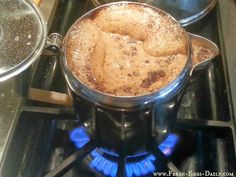 there is a pot on the stove with some food in it