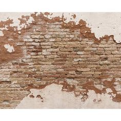 an old brick wall with peeling paint on it