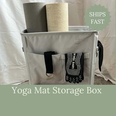 the yoga mat storage box has two pairs of gloves in it