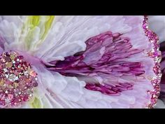 a large flower with lots of pink and white flowers on it's center piece