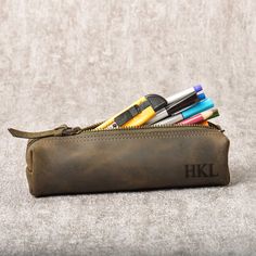 "Professionally designed small cases for your hobbies to hold pencils and paintbrushes of all sizes! Personalized with your initials is a functional carrying case for your pens, pencils, sunglasses, and brushes. We can produce promotional products with their logos for companies! It is suitable to use for both children and adults. Give your loved ones an unforgettable gift experience with a special leather bag that they can always carry with them! You can give all the personalized leather bags fo Pencil Case With Pen Holders For Personal Use, Pencil Shaped Zipper Pouch As Gift, Portable Pencil Case For Personal Use, Rectangular Zipper Pencil Case As Gift, Portable Pencil Case As Gift, Portable Pencil Case For Gift, Zipper Pouch Cases For Back To School, Rectangular Pencil Case With Zipper As Gift, Portable Pencil Shaped Pencil Case For Gift