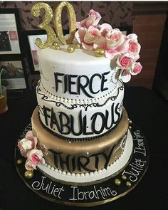 a 50th birthday cake decorated with flowers and the words fierce, fabulous, thirty on it