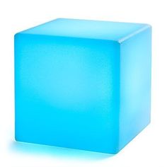 a light blue cube sitting on top of a white surface with no one around it