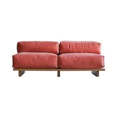 a red couch sitting on top of a wooden frame