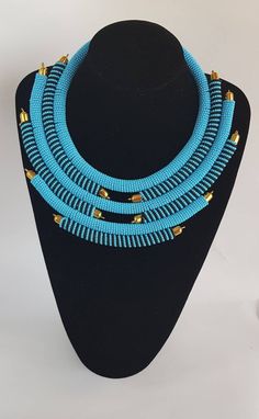 Perfect piece to add to your jewelry set! 100% handcrafted using turquoise and black fine beads. **Buy multiple items and pay shipping for 1 item only.The rest ships free. More neckleces here; https://www.etsy.com/shop/TribalTess?ref=seller-platform-mcnav&section_id=21306083 Back to my shop; https://www.etsy.com/shop/TribalTess?ref=seller-platform-mcnav Turquoise And Black Beads Necklace For Jewelry Making, Handmade Turquoise Bib Necklace With Adjustable Fit, Handmade Adjustable Turquoise Bib Necklace, Turquoise Beaded Bib Necklaces, Handmade Turquoise Bib Necklace With Round Beads, Turquoise Beaded Chain Choker Necklace, Beaded Turquoise Necklace With Round Beads, Handmade Blue Turquoise Necklace, Turquoise Beaded Necklaces With Spacer Beads