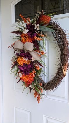 a wreath is hanging on the front door