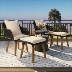 an outdoor patio furniture set with two chairs and a coffee table