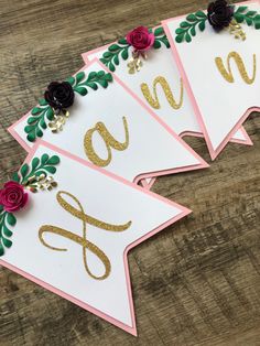 three cards with gold and pink flowers on them, one has the word love spelled in cursive writing