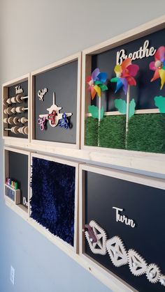 the wall is decorated with different types of paper flowers and broccoli in them