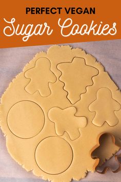 a cookie sheet with the words perfect vegan sugar cookies cut out and ready to be baked