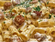 a close up view of some pasta with meatballs