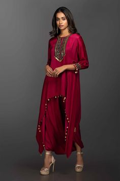 Magenta asymmetrical kurta with Ajrakh embroidery and coin embellishments. Comes with a dhoti skirt.
Components:2
Embroidered
Neckline:Round
Sleeve Length:Three Quarter
Fabric:Satin Silk
Color:Pink
Drawstring at the sides
Sleeves with embroidered hems and button closure
Keyhole button front - Aza Fashions Dhoti Skirt, Dupatta Designs, Cloth Designs, Red Dupatta, Lace Kaftan, Asymmetric Tunic, Coord Sets, Kaftan Designs, Suit Outfit