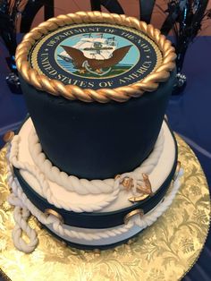 the cake is decorated with navy blue and gold