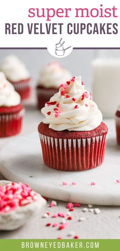 red velvet cupcakes with white frosting and sprinkles on top